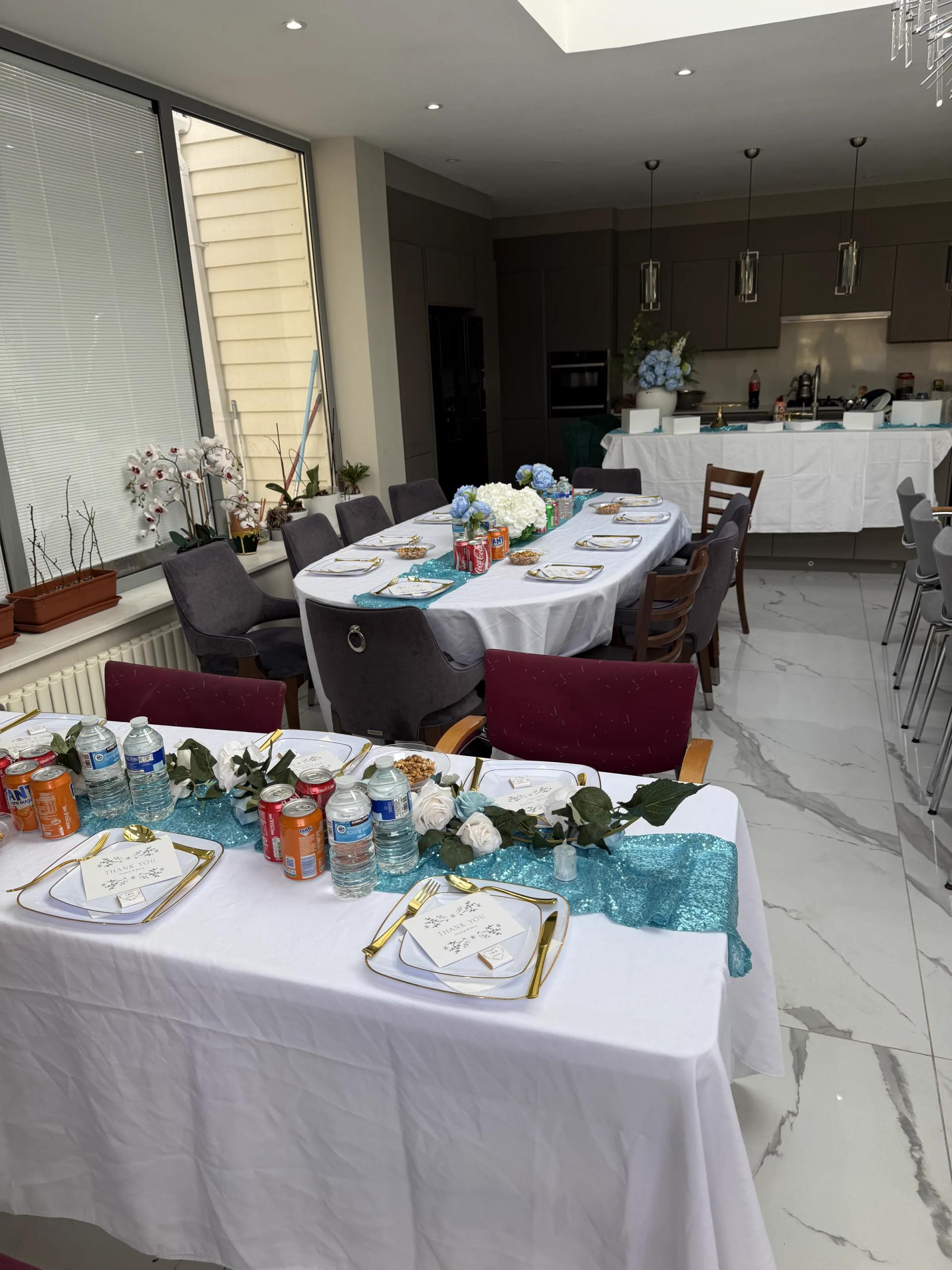 Table detail: gold-edged plates, teal sequin runner, hydrangea centrepieces