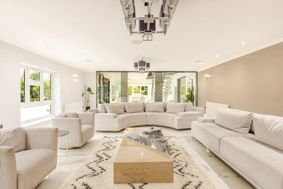 The main lounge — generous cream seating, marble floor