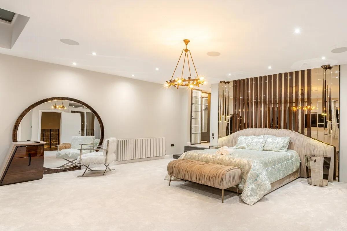 The principal suite — king bed, dressing table, private balcony